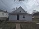 Charming home featuring light siding and a blue front door at 952 N Concord St, Indianapolis, IN 46222