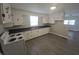 Functional kitchen with white cabinets, laminate countertops, and a new range oven at 952 N Concord St, Indianapolis, IN 46222