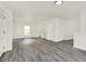 Spacious living room with modern gray floors and fresh white paint throughout at 952 N Concord St, Indianapolis, IN 46222