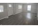 Bright and airy living room with modern wood-look floors and neutral paint at 952 N Concord St, Indianapolis, IN 46222
