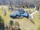 Sprawling white home featuring an outdoor patio and meticulously maintained grounds at 10120 Fox Trce, Zionsville, IN 46077