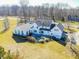 Spacious white home, highlighting a patio and expansive lawns at 10120 Fox Trce, Zionsville, IN 46077