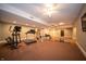 Finished basement features exercise equipment, offering fitness in comfort at 10120 Fox Trce, Zionsville, IN 46077