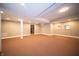 Large finished basement with neutral carpet, recessed lighting, and ample space at 10120 Fox Trce, Zionsville, IN 46077