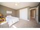 Cozy bedroom with plush carpeting, ceiling fan, and bright natural light at 10120 Fox Trce, Zionsville, IN 46077