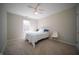 Bright bedroom with soft carpeting and a large window offering ample natural light at 10120 Fox Trce, Zionsville, IN 46077