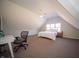 Spacious bedroom with vaulted ceilings and a functional workspace area at 10120 Fox Trce, Zionsville, IN 46077