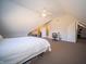 Large bedroom featuring sloped ceilings, a walk-in closet and a study desk at 10120 Fox Trce, Zionsville, IN 46077