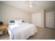 Well-lit bedroom with a ceiling fan and neutral tones and soft carpet at 10120 Fox Trce, Zionsville, IN 46077