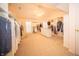 Spacious walk-in closet with custom shelving and ample storage at 10120 Fox Trce, Zionsville, IN 46077