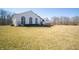 Stunning white home featuring large arched windows and a spacious lawn at 10120 Fox Trce, Zionsville, IN 46077