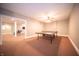 Spacious game room with a ping pong table, perfect for entertaining guests at 10120 Fox Trce, Zionsville, IN 46077