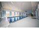 Large indoor swimming pool with a high ceiling, multiple windows, and recreational space at 10120 Fox Trce, Zionsville, IN 46077