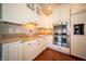 Well-equipped kitchen with stainless steel appliances, granite countertops, and ample storage at 10120 Fox Trce, Zionsville, IN 46077