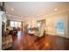 Elegant living room with hardwood floors, a fireplace, and plenty of natural light, perfect for entertaining at 10120 Fox Trce, Zionsville, IN 46077