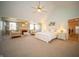 Expansive main bedroom with a fireplace, sitting area, and a king-sized bed at 10120 Fox Trce, Zionsville, IN 46077