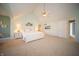 Bright main bedroom with a king bed, ensuite bath, and scenic decor at 10120 Fox Trce, Zionsville, IN 46077