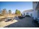 Spacious stone patio with various seating arrangements and a lush lawn at 10120 Fox Trce, Zionsville, IN 46077