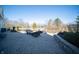 Beautiful stone patio with outdoor seating and a well-manicured backyard at 10120 Fox Trce, Zionsville, IN 46077