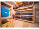 Basement storage area with organized shelving and storage containers at 10120 Fox Trce, Zionsville, IN 46077