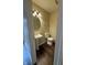 Powder room with a pedestal sink, modern lighting, and neutral paint at 10419 Dark Star Dr, Indianapolis, IN 46234