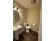 Powder room features a pedestal sink and neutral wall color at 10419 Dark Star Dr, Indianapolis, IN 46234