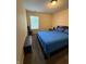 This bedroom has carpet and neutral walls with a window for natural light at 10419 Dark Star Dr, Indianapolis, IN 46234