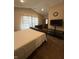 Bedroom featuring vaulted ceilings, neutral carpet and walls, bed, dresser, television, and curtains at 10419 Dark Star Dr, Indianapolis, IN 46234