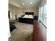 Bedroom featuring vaulted ceilings, neutral carpet and walls, bed, dresser, side tables and windows at 10419 Dark Star Dr, Indianapolis, IN 46234