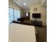Bedroom featuring vaulted ceilings, neutral carpet and walls, bed, dresser, television, and curtains at 10419 Dark Star Dr, Indianapolis, IN 46234