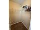Open closet features white wire shelf and neutral walls at 10419 Dark Star Dr, Indianapolis, IN 46234