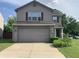 Charming two-story home featuring a two-car garage and well-maintained landscaping, perfect for Gathering living at 10419 Dark Star Dr, Indianapolis, IN 46234