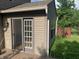 Charming home exterior with sliding glass doors leading to a deck and a well-maintained yard at 10419 Dark Star Dr, Indianapolis, IN 46234