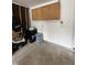 Garage featuring overhead storage cabinets and space for a refrigerator or freezer at 10419 Dark Star Dr, Indianapolis, IN 46234