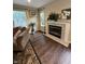 Cozy living room features fireplace, wood floors, and plenty of natural light at 10419 Dark Star Dr, Indianapolis, IN 46234