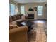 Comfortable living room with plush sofa, fireplace, and natural light at 10419 Dark Star Dr, Indianapolis, IN 46234