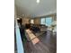 Open-concept living room featuring hardwood floors, ample natural light, and a comfortable seating area at 10419 Dark Star Dr, Indianapolis, IN 46234