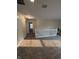 Carpeted upstairs loft area with white railing, neutral walls and carpeted floor at 10419 Dark Star Dr, Indianapolis, IN 46234