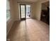 Room with view to backyard deck and sliding glass doors at 10419 Dark Star Dr, Indianapolis, IN 46234
