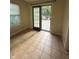 Bright room with neutral walls, and sliding glass doors to the outdoor deck at 10419 Dark Star Dr, Indianapolis, IN 46234