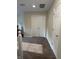 Carpeted upstairs hallway featuring white closet doors and neutral walls at 10419 Dark Star Dr, Indianapolis, IN 46234
