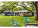 Backyard featuring a fire pit with chairs and a deck, creating an inviting outdoor space at 11710 Prairie Pl, Carmel, IN 46033