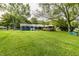 Wide backyard with a grill, patio, fire pit area, and inviting back deck at 11710 Prairie Pl, Carmel, IN 46033