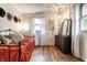 Bright bedroom featuring hardwood floors, decorative hats, and a unique chandelier at 11710 Prairie Pl, Carmel, IN 46033