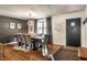 Elegant dining room with a large table, comfortable seating, and contemporary decor with a black accent wall at 11710 Prairie Pl, Carmel, IN 46033