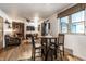 Inviting living room featuring a brick fireplace, hardwood floors, and ample natural light at 11710 Prairie Pl, Carmel, IN 46033