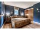 Comfortable bedroom with hardwood floors, two windows, and a closet at 11710 Prairie Pl, Carmel, IN 46033