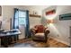 Comfortable office space with hardwood floors, a leather chair, and a window view at 11710 Prairie Pl, Carmel, IN 46033