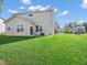 Beautiful backyard with green lawn and patio area, offering outdoor relaxation at 12650 Sunrise Dr, Noblesville, IN 46060