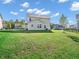 Lush green backyard featuring ample space and manicured landscaping with blue sky at 12650 Sunrise Dr, Noblesville, IN 46060